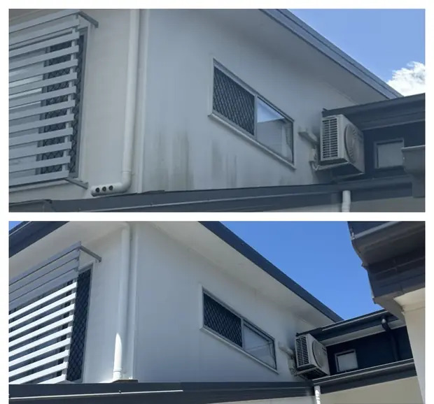 Before and after soft washing mould streaks off a painted upper storey wall in Robina, Gold Coast